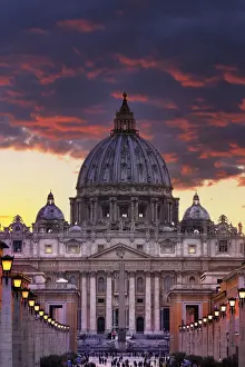 Italy, Rome, St. Peter Basilica by night reflecting on Tevere river