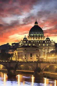 Italy, Rome, St. Peter Basilica by night reflecting on Tevere river