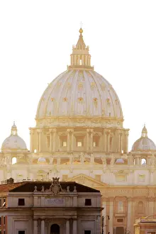 Italy, Rome, St. Peter Basilica at sunset reflecting on Tevere river