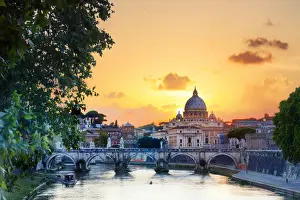 Italy, Rome, St. Peter Basilica at sunset reflecting on Tevere river