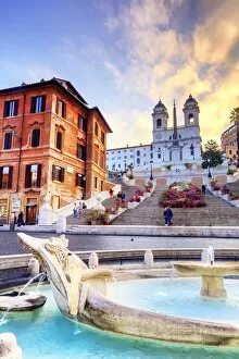 Italy, Rome, Trinita dei Monti stairs and Barcaccia fountain at Spain square at sunrise