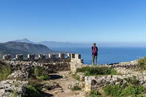 Cefalu Prints: Italy, Sicily, Cefalu, a hiker admires the view of the coastline around Cefalu