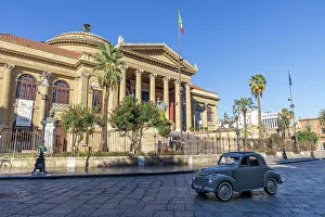 Italy, Sicily, Palermo, Teatro Massimo, a vintage Fiat Uno drives past the Opera House