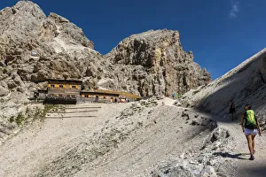 Trento Prints: Italy, Trentino Alto Adige, Val di Fassa, Hiker on his way to the Principe mountain hut
