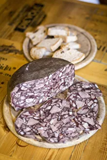 Lucca Prints: Italy, Tuscany, Serchio Valley, Sliced air-cured pork meat named Biroldo in a tavern of