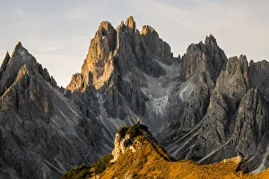 Italy, Veneto, Belluno district, Auronzo di Cadore, hiker surrounded by the peaks of Cadini