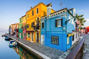 Italy, Veneto, Venice, Burano island, the sun rises on the typical colored houses