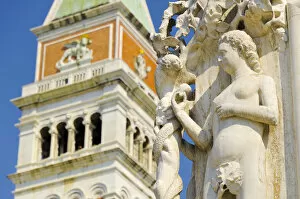 Italy, Veneto, Venice, The Campanile (Bell Tower) and carving on corner of Doges'