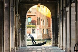 Tradition Gallery: Italy, Veneto, Venice. Gondola passing on Grand canal seen from a colonnade