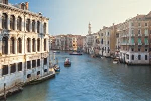 Italy, Veneto, Venice, view on the Grand Canal at sunrise with boats passing through