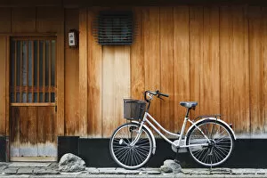 Bicycle Gallery: Japan, Chubu Region, Kyoto, Gion. A bicycle rests against the wall of a traditional