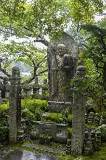 Japan, Kyoto, Arashiyama, Adashino Nenbutsu-Ji Temple, - Buddhist statue at the entrance