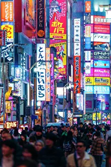Crowd Prints: Japan, Tokyo, Crowds walk past neon signs in Kabukicho entertainment district