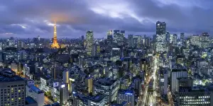 Japan, Tokyo, elevated night view of the city skyline and iconic illuminated Tokyo Tower