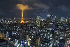 Japan, Tokyo, elevated night view of the city skyline and iconic illuminated Tokyo Tower