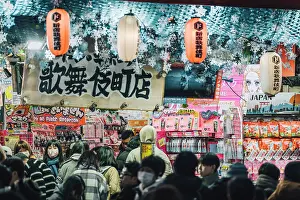 Retail Prints: Japan, Tokyo, Shoppers browse goods in a busy shop in Kabukicho district