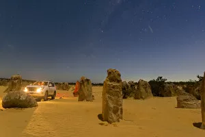 Western Australia Collection: Jeeps headlights at night in the Pinnacle Desert, Western Australia