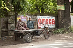 Images Dated 7th April 2016: Jessore, Bangladesh. Two men take a rest from transporting goods around Jessore