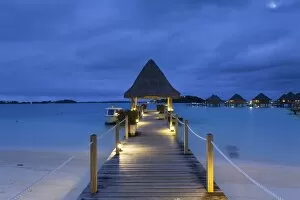 Images Dated 30th July 2015: Jetty of Intercontinental Bora Bora Le Moana Resort at dusk, Bora Bora, Society Islands