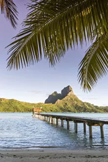 Images Dated 30th September 2015: Jetty at sunrise, in the lagoon of Bora Bora, French Polynesia