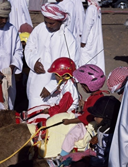 Head Dress Prints: Jockeys wait in line on their mounts ready to be lead