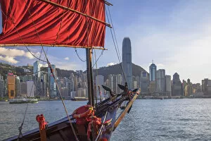 Images Dated 27th August 2020: Junk boat and skyline of Hong Kong Island, Hong Kong