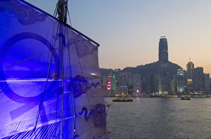 Junk boat in Victoria Harbour at dusk, Hong Kong Island, Hong Kong