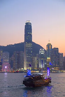 Junk boat in Victoria Harbour at dusk, Hong Kong Island, Hong Kong