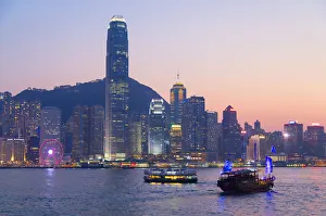 Junk boat in Victoria Harbour at dusk, Hong Kong Island, Hong Kong