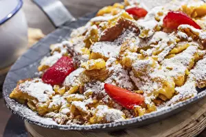 Snack Station Prints: Kaiserschmarrn with strawberries in an iron pan on a mountain hut in Reintal