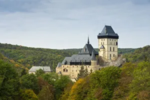Karlstejn Castle amidst trees in autumn, Karlstejn, Beroun District, Central Bohemian Region, Czech Republic
