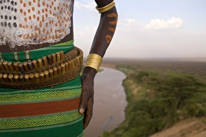 Karo Tribesman wearing a belt of bullets, Lower Omo Valley, Ethiopia Karo Tribesman wearing a belt of bullets, Lower Omo Valley, Ethiopia