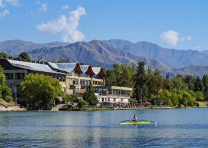 Sport Gallery: Kayakers on the lake with Andes in the background, General San Martin Park, Mendoza