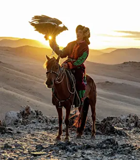 Mongolia Prints: Kazakh Eagle at sunset on horseback with his trained golden eagle