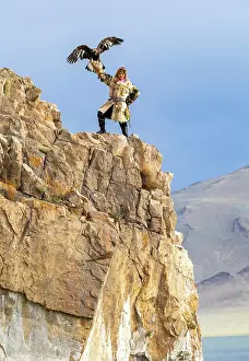 Clifftop Prints: Kazakh Eagle with his trained golden eagle