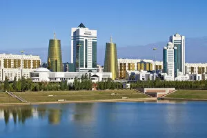 Images Dated 30th November 2011: Kazakhstan, Astana, City skyline reflecting in Isahim River