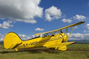 Air Plane Prints: Kenya, Laikipia, Lewa Downs. Will Craigs 1930s style Waco Classic open cockpit bi-plane for the ultimate