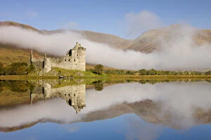 Images Dated 8th April 2022: Kilchurn Castle reflected in the perfectly still Loch Awe, Argyll & Bute, Scotland