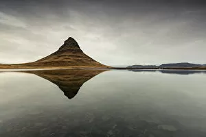 Images Dated 23rd February 2016: Kirkjufell Mountain reflects itself on the Atlantic waters in Snaefellsnes peninsula