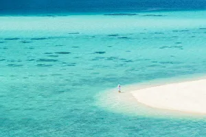Images Dated 26th March 2018: Ko Lipe, Satun Province, Thailand. Tourist admring the turquoise water from a white beach strand