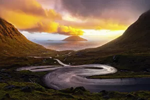 Images Dated 27th February 2023: Koltur island with a bendings road in the foreground, Streymoy, Torshavnar municipality