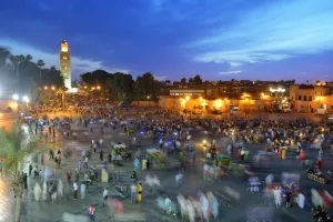 Street Life Prints: Koutoubia minaret at dusk and Djemaa el-Fna Square. Marrakech, Morocco