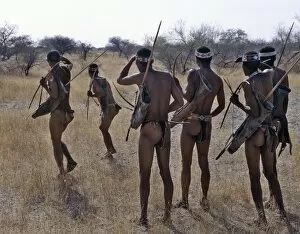 Namibian Tribe Gallery: !Kung hunter-gatherers pause to check a distant wild