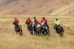 Kyrgyzstan, Issyk Kul Lake, men playing dead goat polo (Buzkashi)