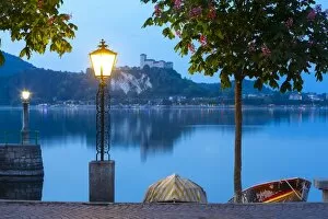 Images Dated 11th May 2015: La Rocca fortress viewed from Arona at dusk, Lake Maggiore, Piedmont, Italy