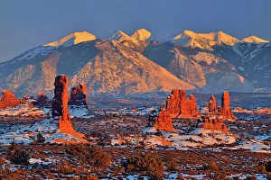 Cold Prints: La Sal Mountains and sandstone spires at sunset, Arches National Park, Utah, USA