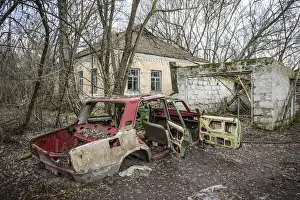 Soviet Era Prints: Lada car and house in an Abandoned village inside the Chernobyl Exclusion Zone, Ukraine