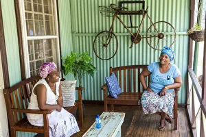 Two ladies on porch of historical building, Pilgrims Rest, gold mining village