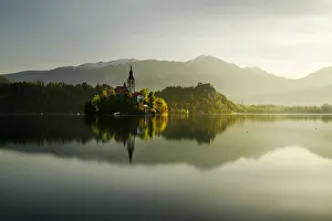 Relfections Prints: Lake Bled during a sunny spring sunrise, Slovenia