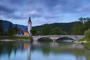 Upper Carniola Prints: Lake Bohinj & The Church of St. John the Baptist illuminated at dusk, Triglav